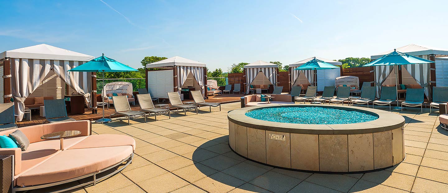 Sky Terrace with firepit, sun chairs and private cabanas