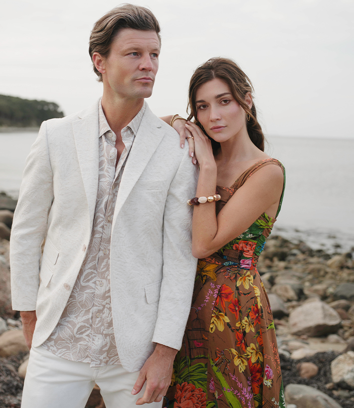 Robert Graham man in white blazer and woman in floral dress