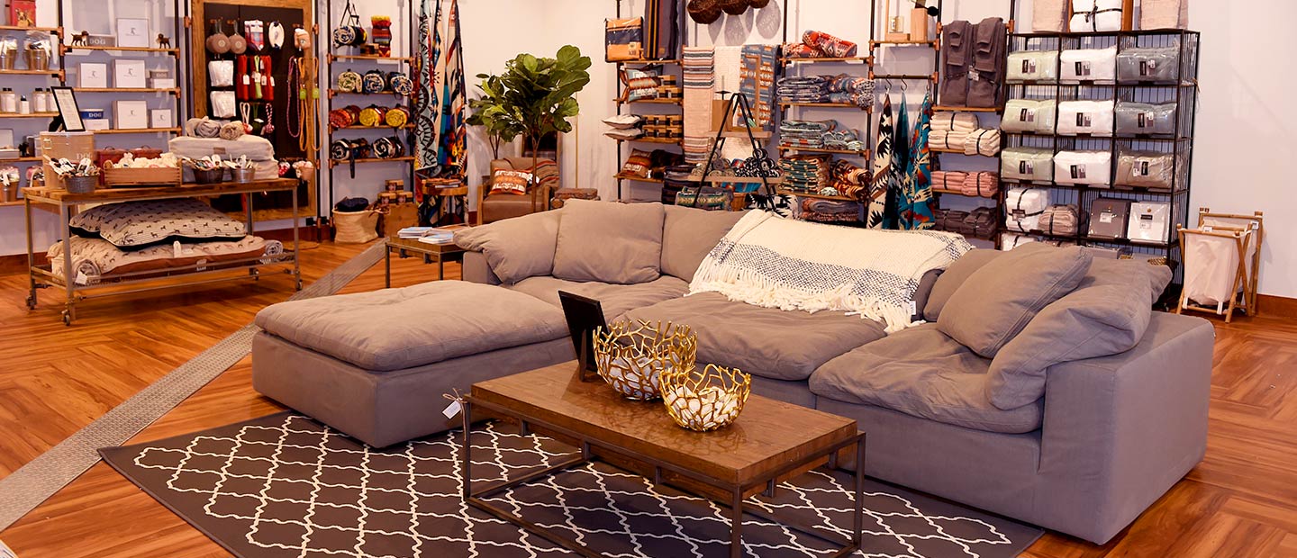 Wide shot of gray couch and home furnishings