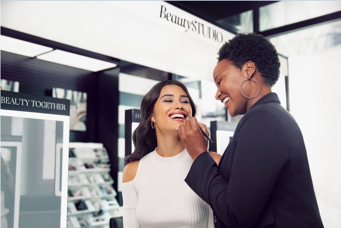 Beauty consultant doing a client's makeup