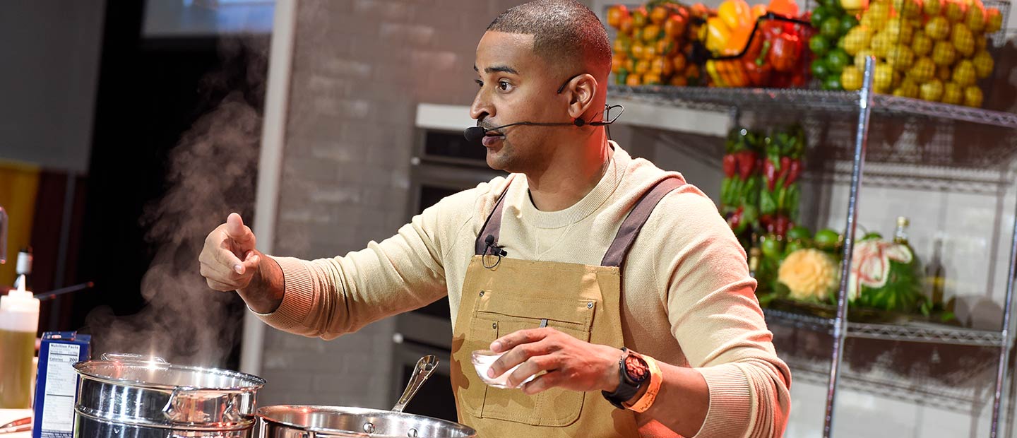 JJ Johnson cooking on stage