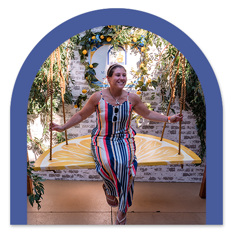 Woman on Sun Patio Photo Op Swing
